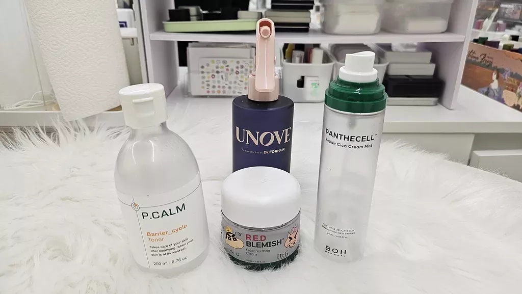 Why Most Sunscreens Cause Breakouts: The Mineral vs. Chemical Guide 2 Flat lay of Dr.G, P.CALM, and Intermission products for why most sunscreens cause breakouts solution.